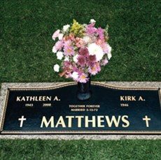 Bronze memorial marker with vase