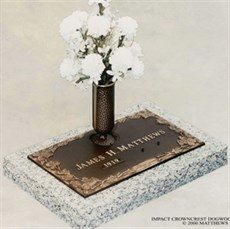 Bronze memorial marker with vase