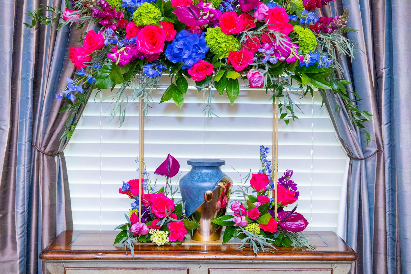 Cremation Burial in Frisco TX - a Cremation urn displayed with colorful memorial flowers